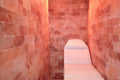 wellness chair in a room with red brick walls