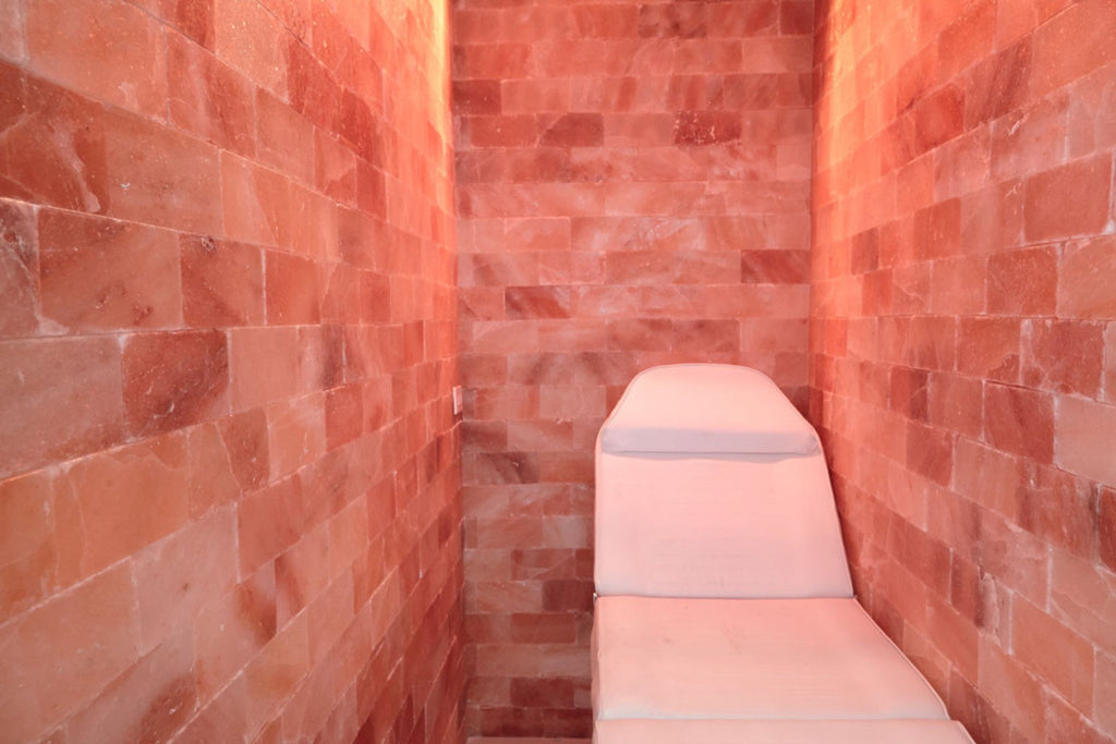Salon chair in a room with red brick walls